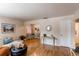 Bright, airy living room with hardwood floors and neutral decor, flowing seamlessly into other living spaces at 753 S Utica St, Denver, CO 80219