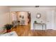 Open-concept living room with hardwood floors, stylish decor, and seamless transitions to adjoining areas at 753 S Utica St, Denver, CO 80219