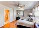 Comfortable main bedroom with hardwood floors and an ensuite bathroom at 753 S Utica St, Denver, CO 80219