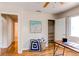 Home office with hardwood floors, and a view into a nearby bathroom at 753 S Utica St, Denver, CO 80219
