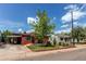 A charming red bungalow with a carport on a tree-lined street with classic curb appeal at 753 S Utica St, Denver, CO 80219