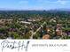 Scenic aerial view of the Park Hill neighborhood showcasing lush greenery and the Denver skyline at 3580 Krameria St, Denver, CO 80207