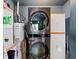 Convenient laundry room with updated washer and dryer with shelving for added storage at 3580 Krameria St, Denver, CO 80207