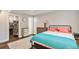 Spacious basement bedroom offering a view into an adjacent room and storage at 5102 S Lisbon Way, Centennial, CO 80015