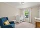 Cozy Bedroom with a crib, armchair, and natural light from a window at 5102 S Lisbon Way, Centennial, CO 80015
