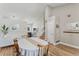 Bright dining room featuring wood floors, a large table with seating, and a staircase at 5102 S Lisbon Way, Centennial, CO 80015