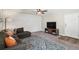 Living room showcases detailed wood paneling, ceiling fan and comfortable furniture at 5102 S Lisbon Way, Centennial, CO 80015