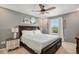 Cozy main bedroom features a ceiling fan, neutral colors and natural light at 5102 S Lisbon Way, Centennial, CO 80015