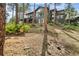 Multi-level home with decks nestled among trees on a sloping lot at 166 S Rainbow Trl, Evergreen, CO 80439
