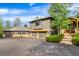 Beautiful exterior with an attached garage, stone accents, and well-maintained landscaping for enhanced curb appeal at 166 S Rainbow Trl, Evergreen, CO 80439