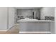 Modern kitchen with stainless steel appliances, quartz countertops and mosaic backsplash at 166 S Rainbow Trl, Evergreen, CO 80439