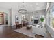 Inviting living room featuring a stone fireplace, hardwood floors, large windows and staircase at 166 S Rainbow Trl, Evergreen, CO 80439