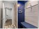 Modern mudroom features wood accents, a bench, and storage shelves at 166 S Rainbow Trl, Evergreen, CO 80439