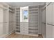 Well-organized walk-in closet with built-in shelving and drawers at 166 S Rainbow Trl, Evergreen, CO 80439