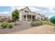 Charming two-story home featuring a well-maintained backyard with a patio area and gravel landscaping at 16881 E 110Th Ave, Commerce City, CO 80022