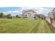 Expansive lawn in a beautiful backyard perfect for outdoor activities and recreation at 16881 E 110Th Ave, Commerce City, CO 80022
