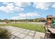 Spacious backyard with lush green lawn and patio area, providing ample space for outdoor activities and relaxation at 16881 E 110Th Ave, Commerce City, CO 80022