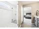 Elegant bathroom with glass shower and seamless transition to the bedroom creating a spa-like retreat at 16881 E 110Th Ave, Commerce City, CO 80022