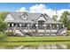 Inviting community clubhouse with a scenic view of the pond, surrounded by green lawns at 16881 E 110Th Ave, Commerce City, CO 80022