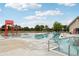 Large outdoor community pool with recreational equipment, lifeguard stand and plenty of lounging chairs at 16881 E 110Th Ave, Commerce City, CO 80022