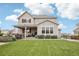 Beautiful home with a manicured lawn, patio, and charming facade, offering curb appeal and outdoor enjoyment at 16881 E 110Th Ave, Commerce City, CO 80022