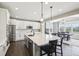 This spacious kitchen features a large island, stainless steel appliances, and hardwood floors at 16881 E 110Th Ave, Commerce City, CO 80022