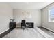 This is a cozy home office featuring a desk, chair, and neutral-toned walls at 16881 E 110Th Ave, Commerce City, CO 80022