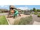 Community playground with slide, trampoline, and playhouse offers recreational fun at 16881 E 110Th Ave, Commerce City, CO 80022