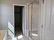 Clean bathroom showcasing a tiled shower, a closet, and white fixtures at 16815 Mckay Dr, Mead, CO 80542