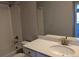 Well-lit bathroom featuring tile surround tub and shower, and a quartz countertop vanity at 16815 Mckay Dr, Mead, CO 80542