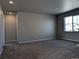 Spacious bedroom with neutral carpet, recessed lighting, and a large window at 16815 Mckay Dr, Mead, CO 80542