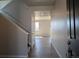 Bright entryway with hardwood floors, staircase, and white trim at 16815 Mckay Dr, Mead, CO 80542