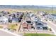 Aerial view of a suburban neighborhood featuring two story homes and solar panels at 8372 Bijou Creek Ave, Littleton, CO 80125