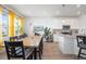 Sun-lit eat-in kitchen combines natural light with stainless steel appliances and granite countertops at 8372 Bijou Creek Ave, Littleton, CO 80125