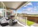 Relaxing covered back deck with seating area, grill, and views of the neighborhood at 9503 Richfield St, Commerce City, CO 80022