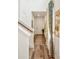 Inviting entryway with wood floors, white walls, and decorative gold artwork at 9503 Richfield St, Commerce City, CO 80022