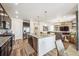 Modern kitchen with granite countertops, stainless steel appliances, and an open layout at 9503 Richfield St, Commerce City, CO 80022