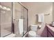 Functional bathroom featuring a shower with glass doors, a toilet, and a single sink with white towel at 8915 Federal Blvd # 203, Denver, CO 80260