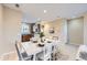 Bright dining area offering seamless access to a modern kitchen and comfortable seating space at 8915 Federal Blvd # 203, Denver, CO 80260