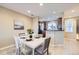 Well-lit dining room features an adjacent kitchen, perfect for easy entertaining at 8915 Federal Blvd # 203, Denver, CO 80260