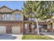 Charming two-story townhouse features brick accents, attached garage and a well-maintained lawn at 8915 Federal Blvd # 203, Denver, CO 80260
