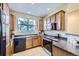 Functional kitchen featuring stainless steel appliances and wood cabinetry at 8915 Federal Blvd # 203, Denver, CO 80260