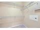 A walk-in closet featuring sturdy metal shelving on white walls and light-colored carpet at 8915 Federal Blvd # 203, Denver, CO 80260