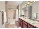 Bathroom featuring double sinks, vanity, and a bathtub with shower at 8915 Federal Blvd # 203, Westminster, CO 80260