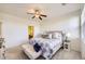 Bright bedroom features a ceiling fan and a window at 8915 Federal Blvd # 203, Westminster, CO 80260