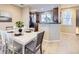 Bright dining area with wood floors and ample seating space near the kitchen at 8915 Federal Blvd # 203, Westminster, CO 80260