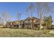 Charming townhome with a brick facade, mature trees and a well-maintained lawn at 8915 Federal Blvd # 203, Westminster, CO 80260