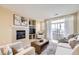 Inviting living room with a cozy fireplace, and sliding glass doors to a patio at 8915 Federal Blvd # 203, Westminster, CO 80260