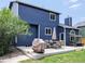 Backyard with patio area, complete with seating, grill, and well-maintained lawn, ideal for outdoor living at 5695 W 109Th Cir, Westminster, CO 80020