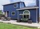 Charming backyard features an outdoor dining area and a relaxing porch swing on a concrete patio at 5695 W 109Th Cir, Westminster, CO 80020